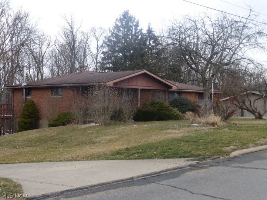 Lovely brick ranch home on nearly 1 acre lot in Edgeworth Addition offering brick exterior, attached garage, partially finished basement, 3 bedrooms, large living room, nice kitchen with lots of cabinet space, 2 full baths, paved drive, beautiful inground pool and a great location convenient to city park, schools and local hospital.