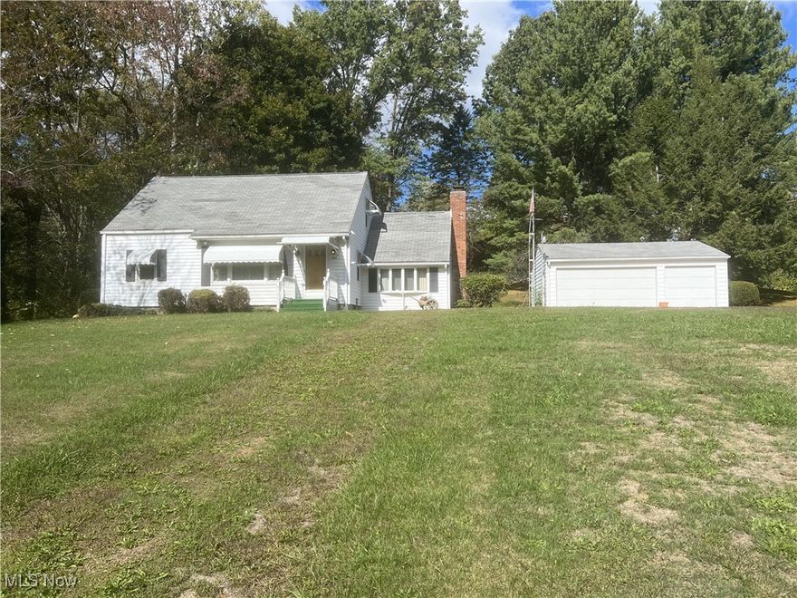 This property features 3 Bedrooms  and 2 Full baths with 1,294 sq. ft. A single family cape cod home on 1.05 acres with a 3-car detached garage, storage shed & concrete driveway. First floor has a kitchen with appliances and a breakfast bar, a beamed family room with a gas insert fireplace & built-in cabinets, living room, 2 bedrooms & full baths.  Second floor has a 3rd bedroom with a ton of storage space.  There is a full basement with shower bath, electric breaker, F/A Carrier furnace, AC, and 2 washers and a dryer. The home is serviced by well & septic.  Summit Co., Springfield Twp., Uniontown.  Parcel #5109592.  This is a solid, well-maintained home awaiting your updates and family!
