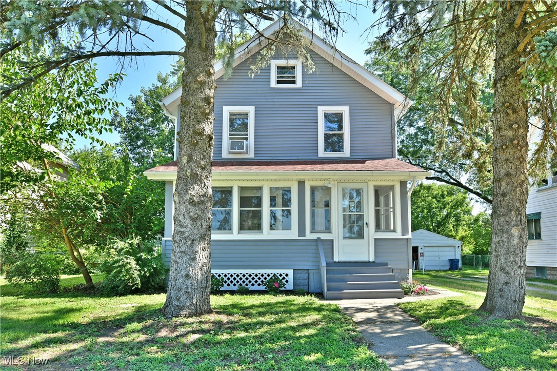 Combine sleek, modern farmhouse styling with a convenient suburban location in this stunning, fully updated home! Offering two floors of move-in-ready living space, this home lets you enjoy comfort and style just minutes from desirable shopping and dining. Nestled behind a natural veil of tall trees, the home stands out with its lovely gray-and-white exterior and welcoming, window-lined enclosed front porch, perfect for four-season relaxation. A casual side entrance sits beneath a new awning, while a second entry opens from the raised rear deck that overlooks the tree-lined lot. Inside, the spacious living room greets you with dark hardwood-style flooring and an abundance of natural light. Flowing seamlessly into the heart of the home, the fully remodeled kitchen and dining area is nothing short of breathtaking. Crisp white cabinetry lines the walls, paired with shimmering granite that sparkles beneath the glow of recessed lighting, while a grand center island anchors the space, topped with a custom countertop that shines from the elegant pendant lights. Matte gold hardware adds a touch of modern sophistication, perfectly complementing the ornate tile backsplash. First-floor laundry adds everyday convenience and sits just steps away from a brand-new full bath, showcasing a beautifully tiled walk-in shower and a sliding barn door that blends charm with privacy. Upstairs, a lavish full bath awaits with a tile-wrapped shower and soaking tub. Three generously sized bedrooms with new carpet provide bright, cozy retreats, each with personal closet space. The 3rd floor attic offers excellent storage and finishing potential, while the full basement includes provisions for a future third bathroom. Additional features and 2024/2025 updates include: brand-new appliances (all stay), roof ~12 yrs old, HWT ~2 yrs old, electrical and lighting throughout, new gutters and downspouts, freshly painted interior and exterior, and so much more! Plus a one-year home warranty is included!
