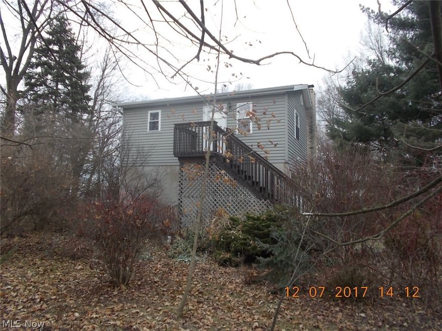 Looking for a "Little" house full of open concept living space. Ready to move into this home with many unique features. Woodstove in basement heats the house but electric base board is available. Nearly one acre of woods and flowers give you a very private setting. Walk-out basement and attached 1 car garage additional detached 26x20 garage and 16x12 out building. This is a one of a kind-must see!!