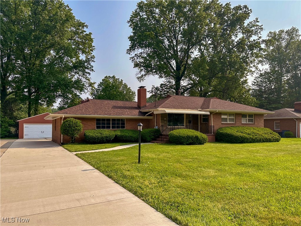 Step into this charming and spacious brick ranch-style home nestled in the heart of Liberty township. This beautiful house sits on a large lot, providing ample space for outdoor enjoyment and relaxation. Conveniently located near shopping, dining and major highways, this property offers both convenience and comfort. The interior has been thoughtfully updated with an open-concept living design, perfect for entertaining guests or simply enjoying everyday life. New flooring, fresh paint, modern lighting and updated fixtures throughout make these rooms bright, airy and inviting. The spacious living room features a stone fireplace and flows nicely into the remodeled kitchen. Featuring gleaming granite countertops, glass tile backsplash, stainless steel appliances and a large center island, it's the perfect place to cook and chat. Adjacent to the kitchen is a nice-sized dining room with French doors leading to the covered patio and backyard. Three bedrooms, all with large closets, and a spacious three-piece bathroom complete the main level. The finished basement offers a rec room, second kitchen, full bath, laundry room and storage area. And just when you thought this property couldn't get any better, you discover not one, but TWO GARAGES with space for four cars. Whether you're a car enthusiast or someone who needs extra room for lawn equipment, toys or tools, you'll find it here! There is also an extra-wide concrete driveway for additional parking and a huge backyard and patio for outdoor recreation and relaxation.