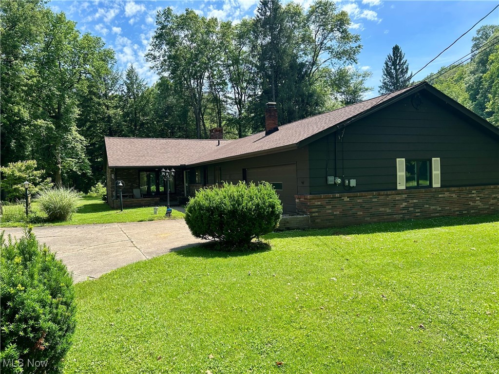 This beautiful, mostly brick ranch-style home built in 1962 is tucked away on a secluded dead-end street in Russell Township, Geauga County, Ohio. Set on 1.3 acres along the scenic Chagrin River, the property offers tranquil riverfront views and a peaceful natural setting. Inside, the home features three comfortable bedrooms, one full bathroom, and one half bath across 1,775 square feet of living space. The attached 2.5-car garage includes a rear workroom ideal for projects or storage. Additional features include a shared driveway, oil heat, and a well and septic system. Sold “As Is,” this property presents a unique opportunity for those seeking privacy, charm, and a coveted location.