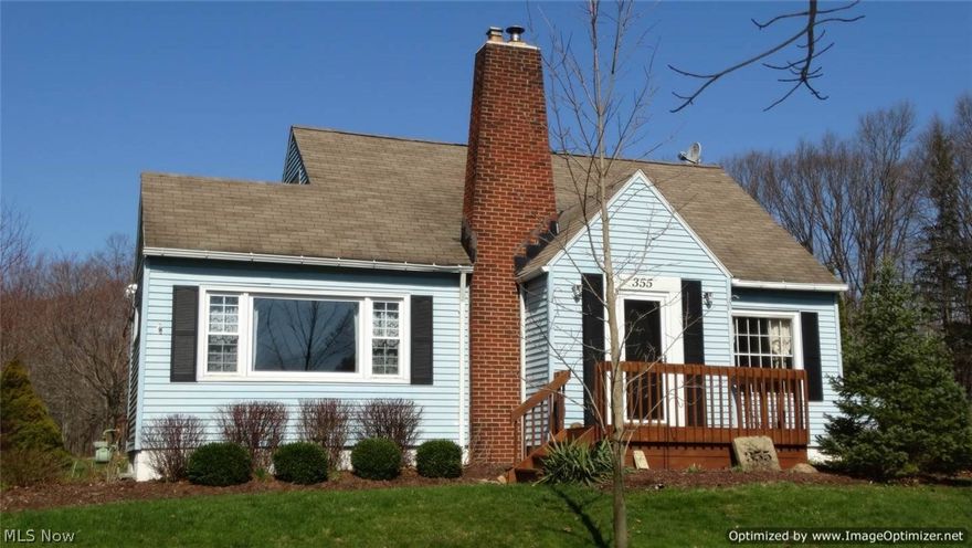Beautifully Maintained 3 Bedroom & 2 Full Bath Bungalow set on nearly 1 acre in Chardon Village! This charming home includes updated kitchen & baths, tasteful décor, arched doorways and hardwood floors throughout first floor. Front entrance welcomes you into the Living Room with recessed lighting, brick fireplace & wood burning stove insert. Dining Room with beamed ceiling, wainscoting & large picture window. Kitchen with ceramic tile backsplash, new flooring & all appliances included. 1st floor Bedroom & 1st floor full bath with walk-in ceramic shower & floors. 2 bedrooms on second floor with recently updated full bath. Central air. Full Basement all open with great storage, newer electrical panel & HWT. Vinyl windows & siding. New shutters. Manicured village lot with storage shed, front deck & brick patio to enjoy extra deep backyard. 1-yr Home Warranty. City sewers. Close to shopping, restaurants and minutes to Historic Chardon Square!