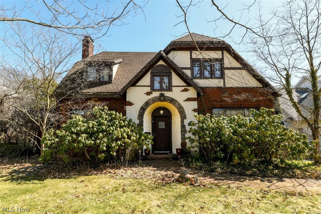 Welcome home to this perfectly located, cottage-style Tudor home, designed by renowned Akron architect Roy Firestone. This home is just steps away from Fairlawn Country Club and is surrounded by beautiful, mature trees. This all brick, 4 bedroom home is located in the highly desirable neighborhood of Fairlawn Heights in West Akron. Enjoy hard wood flooring, 9' ceilings, classic arches, curved ceilings and charm located around every corner! An eat-in kitchen, fireplace, 3-season porch and lovely, front music parlor/morning room are some favorite features. The deck off of kitchen overlooks a large, fenced private yard with shed. Some updates include new Furnace (2004), Central Air (2006), (Roof and gutters March, 2010), (Hot Water Heater 2020) and many newer windows. Conveniently located close to shopping, dining and parks! Hurry, schedule your showing today.