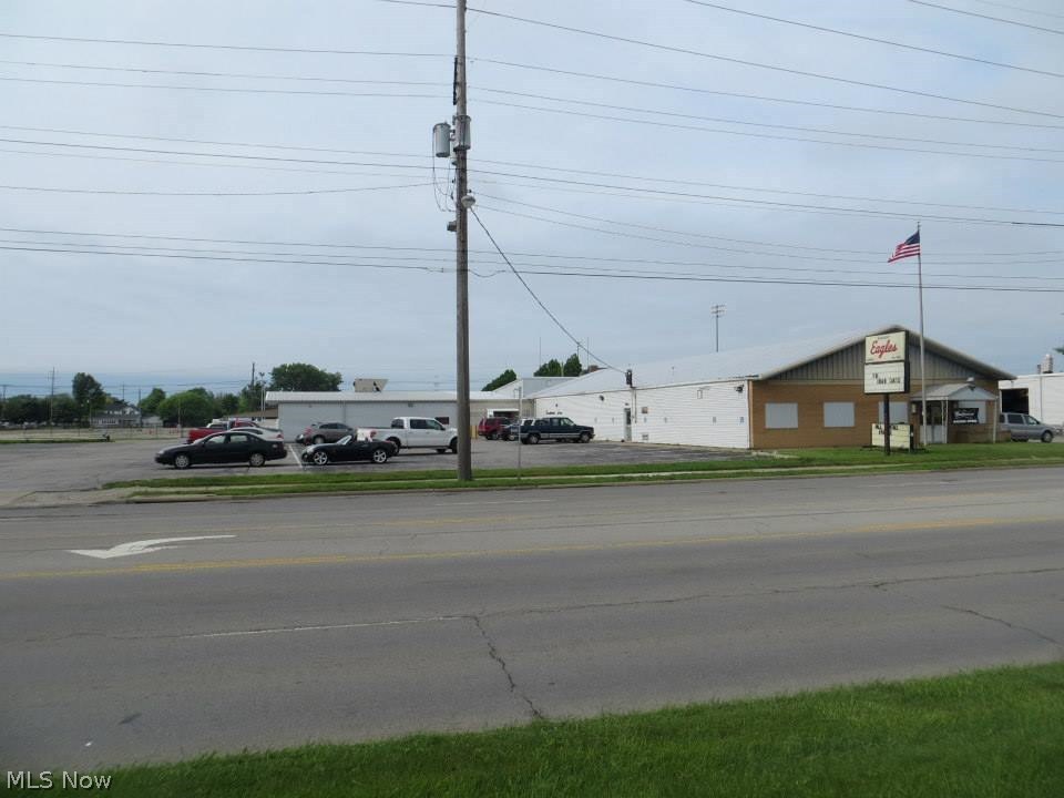 Unique opportunity to grow your business. This structure is located on a main thoroughfare and contains approx. 9700 square foot of space. There are two halls that are available inside the structure, along with a bar, kitchen, and restaurant area. The halls are set up well to provide one larger separate hall with its own restrooms, and one off the west end of the building. There is parking on both sides of the building. This structure is only limited by your imagination.
