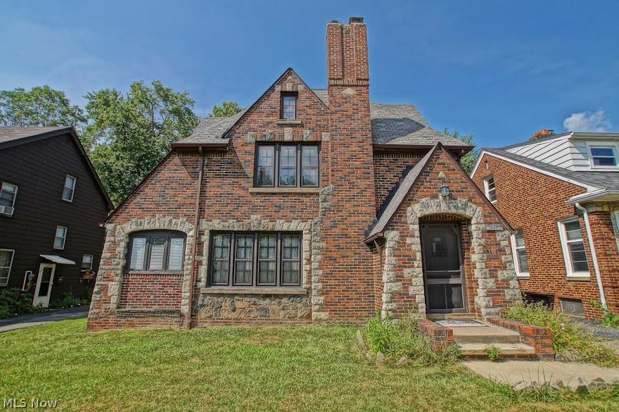Gorgeous brick and stone colonial in sought after Cain Park area. This beautiful home has art deco style stonework around window and door arches, all the charm of natural woodwork, beautifully refinished hardwood floors throughout coupled with all the updates you are looking for.  Some of the numerous unique features of this home include a Master suite complete with sitting room/office with a skylight window and en suite master bath.  Gourmet kitchen features generous counter and cabinet space, island and skylight.  Formal dining room, office and living room with newer wood burner and chimney, finished basement includes spacious family/recreation room.  Park like backyard with patio, perfect for entertaining, walk to beautiful Cain Park, tennis courts, sledding hill, summer music and theater, minutes from downtown, shopping, dining, this home needs to be at the top of your list, call today for a private showing.