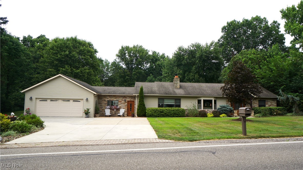 Remarkably renovated in 2017, this sprawling Franklin Township ranch is set on a wooded and private lot with a backyard absolutely to die for. Invite your friends and family over to take a refreshing dip in the heated in-ground pool, zip down the slide, or just relax poolside on the patio and deck. Bring the gathering inside to the masterfully designed kitchen with a massive island, Cambria granite counters and high-end stainless steel Thermador appliances. From the road, stone accents highlight a classic façade while a winding path frames beautiful landscaping offering access to the stamped concrete patio and a Craftsman style covered front porch. The enormous garage has room for 3 cars, overhead and attic storage, and a built-in workshop. Enter through an ornate front door flanked with sidelights, a rustic stone hearth surrounds a gas fireplace while a classic medium brown laminate flooring establishes warmth and harmony throughout the first floor. Built-in dry bar is strategically located to serve the living room, kitchen and exterior of the home through the sliding glass doors. 9 ½’ x 4 ½’ island anchors the Kitchen. With ample storage, a gas cooktop and seating for 5 the island provides versatility. Top-of-the-line Range Hood, Refrigerator, Dishwasher, Double Wall Oven and Drawer Microwave round out the amenities of this Chef’s Kitchen. A formal Dining area adjacent to the kitchen easily accommodates larger gatherings. Functional mud/laundry room with ceramic tile flooring is sandwiched between the garage entrance and the kitchen. A charming office with cathedral ceilings and hardwood floors harkens back to the home’s original design. Down the private hallway off the living room, 3 Bedrooms and 2 nicely updated Full Baths are joined by a sizable Rec Room with sliding door access to deck and pool. A bonus room has also been converted into a large walk-in closet for extra storage and flexibility. Call your favorite realtor today to schedule a private showing!