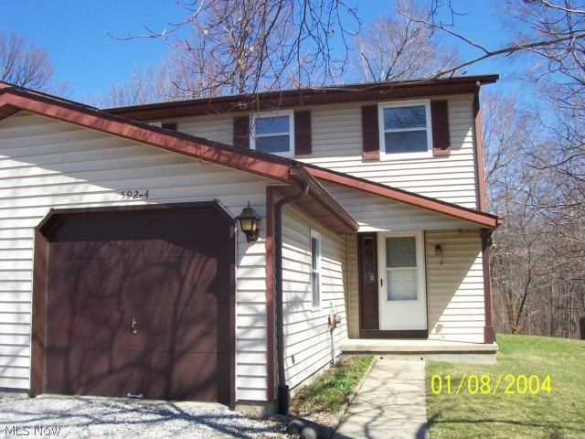 Move in ready townhome with updated floor coverings, kitchen cabinets, countertops, appliances, baths, garage door opener & more. Full basement with washer & dryer included. Nice patio off the living room with backyard extending into the woods. No association or maintenance fees. Great neighborhood on the edge of town, just off SR 42 & US 224 with easy access to I-71 & I-76. This one will surprise you! Take a look!