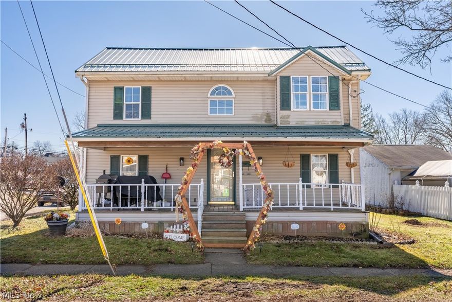 In town and ready for you. Come tour this 3 bd 1 1/2 bath home. Move-in ready and updated. New carpet installed. Metal roof for convenience. The living room  has a fireplace perfect for keeping warm on cold nights. Covered front and back porches. Lots of updates. Sellers are motivated! Make an offer today. More photos coming soon!