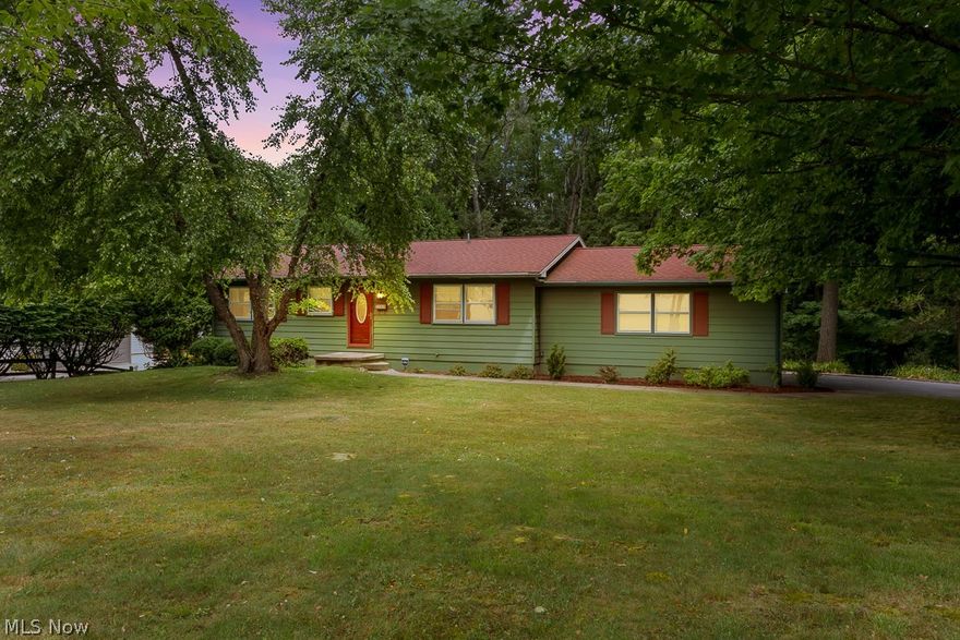 Feel right at home in this well-maintained ranch featuring beautiful hardwood floors and spacious living areas. Retire from the warmth of the cozy eat-in kitchen after dinner to a generously sized living room or one of 3 bedrooms on the main floor. Relaxation is never far away with a large and open recreational room right down the steps including a bar with seating for you and your family or friends. Take the party outside through the French doors leading to a generous and private outdoor patio perfect for grilling, entertaining, or taking in the sounds and sights of nature with a peaceful forest setting. This property is on the edge of town on a quiet street but just blocks from food, coffee, shopping, and the hospital. Kitchen and laundry appliances will be included with this move-in-ready home. Owner upgrades and maintenance include but are not limited to: Driveway Re-Sealing (Fall 2023), New Central Air (Summer 2023), Radon Mitigation System (2022).