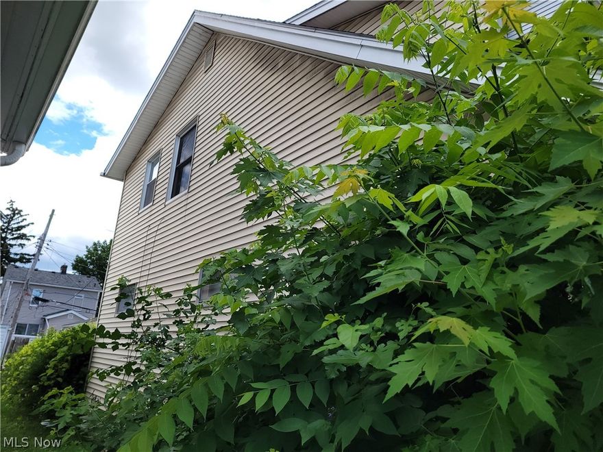 Welcome to this charming vinyl-sided colonial, offering a blend of classic design and modern potential. A welcoming front porch sets the tone for this inviting home, perfect for enjoying a morning coffee or relaxing in the evening. The property features a 2-car detached garage and a backyard with a privacy fence, providing both security and a peaceful outdoor space for entertaining or relaxing. Inside, the eat-in kitchen offers a cozy spot for casual meals, while the formal dining room, complete with built-in cabinets, provides an elegant space for family dinners and gatherings. The living room boasts a decorative fireplace, adding warmth and character to the home. The spacious master bedroom is a highlight, offering a comfortable retreat. Two additional bedrooms provide ample space for family, guests, or a home office. The partially finished basement includes laundry facilities, adding convenience and extra living space potential. While the home is in need of updating and freshening, it presents an exciting opportunity to personalize and enhance to your taste. Embrace the charm and potential of this colonial home, where classic features meet modern possibilities, creating the perfect canvas for your dream living space.