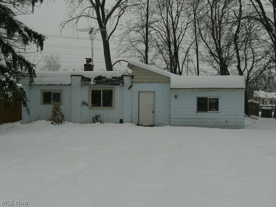 SOS!!! I am feeling needy! Need a little paint, drywall, plumbing, electrical, flooring, heating, etc, etc, etc. . . OK, so I need a little bit of everything. This home offers a deep yard with a great set back.  One floor living with 2 bedrooms and one bath. A nice size living room with wood burning fireplace, and an eat-in kitchen. Utility room for your washer and dryer. Come and get it, call today!  Property is SOLD "AS IS" and "WHERE IS" and without WARRANTY EXPRESS OR IMPLIED. All information deemed reliable but, not guaranteed. POS and repairs if necessary are responsibility of the Buyer. Please check with City of Painesville for any violations issued by them.