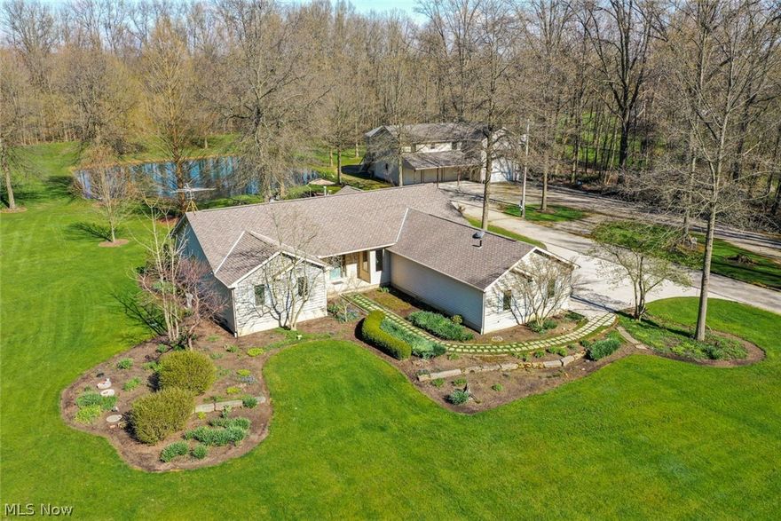 This private custom green built home is nestled on 13.81 acres and sits 1400 ft off the street. Enjoy the peaceful back patio over looking the pond while watching the wildlife. Some of the home features are ABC Seamless Steel siding (w/a lifetime warranty), foam walls for the ultimate insulation, floor joists w/2x12 construction, Pella windows with slim shades, a newer garage door, a newer furnace, air, and hot water tank, an irrigation system, & ADT security system, first floor laundry, & an open floor plan. The kitchen has granite countertops with black stainless steel appliances. ** Attached to the home is a separate office which would be great for working from home in these times. *** The outbuilding boasts a 14x14 door and could store 6 plus cars or a full size RV with room to spare, separate 200 amp electric, floor heat tubes, an RV dump station, a bathroom, heat, water. On the 2nd floor there's 1056 SqFt that is layed out to be a guest area and is plumbed/wired for a bath and ki