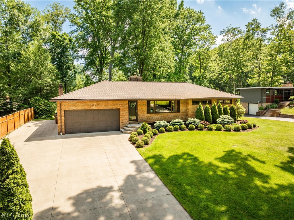 Welcome to this beautiful all-brick ranch home located in the desirable New Franklin/Manchester School District. This charming residence boasts 3 bedrooms, 2.5 bathrooms, and sits on over half an acre of land. As you enter, you'll be greeted by a spacious family room with fireplace featuring hardwood floors, perfect for gatherings. The updated kitchen is fully equipped with modern appliances and flows seamlessly into the dining area and the large family room with fireplace, creating an open and inviting space. A delightful surprise awaits in the form of a large four-season sunroom, complete with a wood-burning stove, providing a perfect spot to relax year-round. The primary bathroom has been completely remodeled including heat/light/fan combo. All three bedrooms on the main floor feature beautiful hardwood floors. The partially finished lower level offers additional recreational space and plenty of extra storage. Step outside to your own backyard paradise, featuring a large 12x20 shed with electricity, perfect for storage or a workshop. HVAC-Main House 2022, This home offers so much more – come see for yourself!
