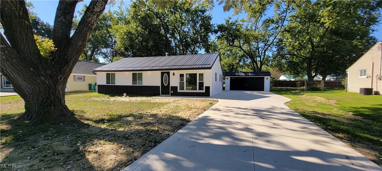 Stunning transformation here! This ranch has been brought to life with exceptional, quality craftsmanship throughout. Rebuilt inside and out and even underneath! This is as close to new construction as you can get. Brand new concrete driveway, new siding, new metal roof and lighted soffits give this home a great curb appeal. Inside is quite impressive with new lighting, floors, walls, paint, block moldings, doors and so much more. Owner's suite with a brand new Master Bath. Added Square Footage includes Laundry room with washer and dryer. The kitchen is spacious and new with a pantry and center island. All appliances stay. Formal dining and living room. Sliders off the Owner's Suite lead to the back yard. New drainage in front. Spacious 2 car garage. Space to toss the football in the backyard! This is a must see! Immediate Occupancy. BUYER BONUS: If under contract by 9/21/25 with a close date before October 21, 2025, a new 12x12 concrete patio will be included (with reasonable offer).