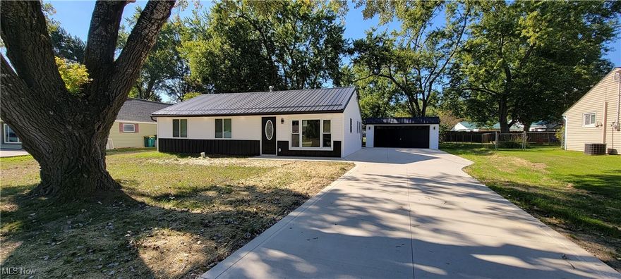 Stunning transformation here!  This ranch has been brought to life with exceptional, quality craftsmanship throughout.  Rebuilt inside and out and even underneath!  This is as close to new construction as you can get.  Brand new concrete driveway, new siding, new metal roof and lighted soffits give this home a great curb appeal.  Inside is quite impressive with new lighting, floors, walls, paint, block moldings, doors and so much more.  Owner's suite with a brand new Master Bath.  Added Square Footage includes Laundry room with washer and dryer.  The kitchen is spacious and new with a pantry and center island.  All appliances stay.  Formal dining and living room.  Sliders off the Owner's Suite lead to the back yard.  New drainage in front.  Spacious 2 car garage.  Space to toss the football in the backyard!  This is a must see!  Immediate Occupancy.   BUYER BONUS:  If under contract by 9/21/25 with a close date before October 21, 2025, a new 12x12 concrete patio will be included (with reasonable offer).