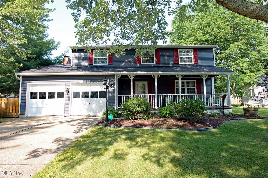 This beautifully maintained 4-bedroom, 2.5-bath Colonial sits on a private lot & offers a perfect blend of comfort, style, & outdoor enjoyment. A charming 7'x25' covered front porch invites you in & sets the tone for the warmth & care found throughout the home. Inside, the main floor features a spacious Living Rm & Formal Dining Rm combo w/newer hardwood floors. The updated Eat-In Kitchen boasts granite countertops, a stone backsplash, stainless steel appliances including a double oven, under-cabinet lighting, & a breakfast bar, perfect for casual meals or entertaining. The cozy Family Rm is a highlight w/wood-burning fireplace, custom built-ins, skylights that flood the room with natural light, & direct access to the beautiful 3-season sunroom. This versatile space opens to the backyard oasis, making it ideal for year-round enjoyment or a home office. Upstairs, you’ll find four generously sized bedrooms & two full bathrooms, including an updated en-suite in the Primary bedroom. In the lower LL, the finished portion of the basement provides a 14'x22' recreation room, great for a media room, home gym, or play area—along w/laundry & plenty of storage space, plus 10 x 20 crawl space 5' tall for extra storage. Step outside & enjoy the tranquil backyard, fully fenced for pets & little ones. Relax on the 16'x20' deck, a gazebo with a glider, or on the paver patio while enjoying the sights & sounds of the year-round koi pond & waterfall. A charming Wisteria tree, Concord grape vines, & a 10’x12’ shed with an additional 5’x10’ storage section. String lights connect the gazebo to the shed, creating a magical setting for evening gatherings. Additional highlights include: Newer carpet throughout the whole 2nd level, & the 3-season sunroom (July 2025), Newer central A/C (June 2025), Newer fence (June 2024), Furnace (Dec 2020), Update Roof & New Skylights (Oct 2020), & Windows were replaced. 2 car attached garage w/openers. Plus, a 1-year Home Warranty. Begin your Story Here!