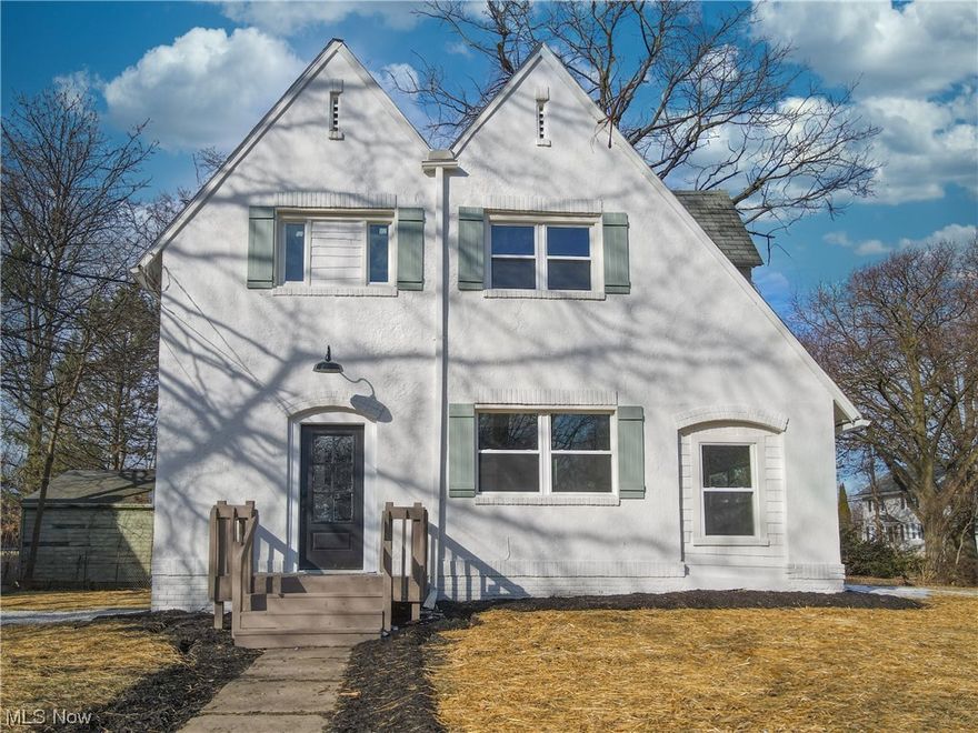 Welcome home to 498 Watson St. Akron OH 44305. Nestled in the heart of the iconic Goodyear Heights neighborhood, sits this 1919 built German-style colonial that has been remodeled from inside to out, bringing a modern touch to a timeless classic. When you walk into the foyer, notice the custom woodwork throughout the first level along with the high ceilings and SO much natural light beaming through all of the large, newly installed Polaris windows. Make your way into the kitchen that has truly been transformed with floor to ceiling custom built-ins and cabinetry, newer gas stove and refrigerator, granite countertops, and subway tile backsplash. Round the corner to the formal dining room featuring custom coffered ceilings and woodwork and imagine spending time around the table with friends and family. Enjoy cozying up together in the living room by the wood burning fireplace that features a brick raised hearth, more built-in shelves and woodwork, and easy TV install. Finishing off the main level is a step-down 4 seasons room that allows for extra living space, as well as a half bathroom for convenience! Move on upstairs to find the Master Bedroom with more custom woodwork and coffered ceilings, as well as 2 additional well-sized bedrooms and the full bathroom, which was also completely transformed with tile shower surround and flooring. Additional updates not mentioned above: new plumbing, some new electrical, whole house Sherwin Williams paint, and drylok painted basement. Call your agent today to set up an in-person tour and come see for yourself why 498 Watson St. Akron holds the keys to your heart and your new home!