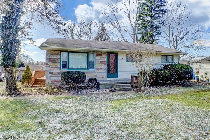 Mid century solid retro ranch with hardwood floors throughout (some distressed), a spacious living room, applianced kitchen with a separate eating area with knotty pine wainscotting and three bedrooms.   There is also a wrap around deck, full, very usable basement and attached garage.  This property is an ideal starter home, especially for the do-it-yourself buyer.  Full basement also has all of the fixtures for another bath but they are not enclosed.  Included appliances are as-is.  Home warranty included.  And, for those of you who enjoy the out doors, this home is an easy 3 block walk to the bike and hike trail head and close to the Cuyahoga River for your kayaking adventure!