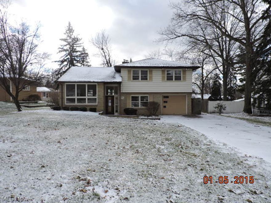 This is a Fannie Mae Home Path Property. Stone and alum 4 level split with attached garage and rear covered concrete patio. First floor family room has a stone fireplace  with access to garage and lower partial basement level  Upper level has kitchen, dining room and living room . Third level has a full bath with his and hers sinks, tub and shower plus three bedrooms.  Excellent Howland Tpw location close to conveniences.  The seller has directed that all offers on this listing be made using the Home Path Online Offer system