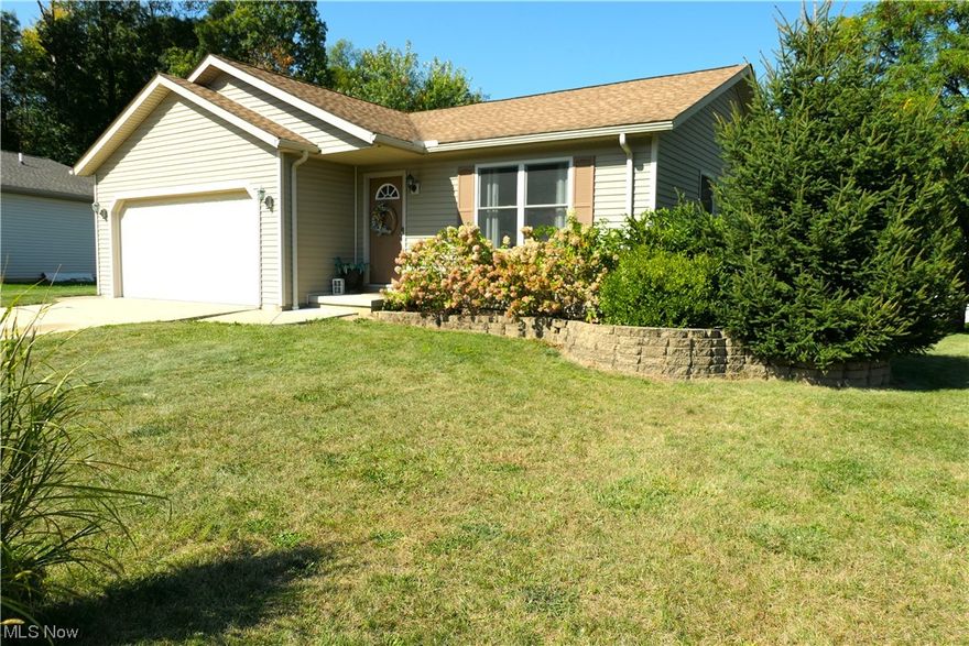 This property features two separate lots and a charming 3 bedroom, 3 bathroom home. Upon entering, you'll be greeted by a stunning vaulted ceiling in the living room that gives the space an open and airy feel. The kitchen is equipped with all the necessary appliances including Range, Refrigerator, Dishwasher, Microwave Range Hood, washer and dryer.  The kitchen includes a cozy dining area. Downstairs, you'll find a finished family room complete with a bar, perfect for entertaining friends and family. Additionally, the home boasts a security system for added peace of mind. Outside, a deck at the rear of the home provides the perfect spot for enjoying a cup of coffee or hosting a summer barbeque. This property truly has it all, offering the best of both indoor and outdoor living.