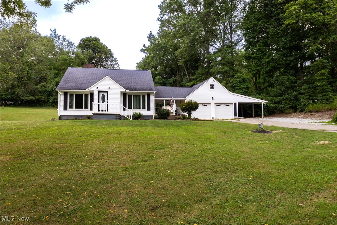 Welcome home to this darling 3-bedroom, 2 bath Cape Cod in NEW Franklin nestled on 2 parcels equaling almost .75 acres. Step inside to find refinished original hardwood floors, Anderson windows and doors, and oversized windows that fill the home with natural light. The inviting breezeway connects the home to a 2 car garage, with an additional carport for extra parking. Above the garage, a spacious loft offers endless possibilities perfect for a home office, studio, or bonus room. The walk-out basement features a cozy fireplace and has the potential to be finished into an inviting family room or additional living space. Enjoy the perfect balance of peaceful country living while still being centrally located near Portage Lakes, Green, Barberton, and Canal Fulton. Don’t miss this wonderful opportunity to make this charming property your new home!