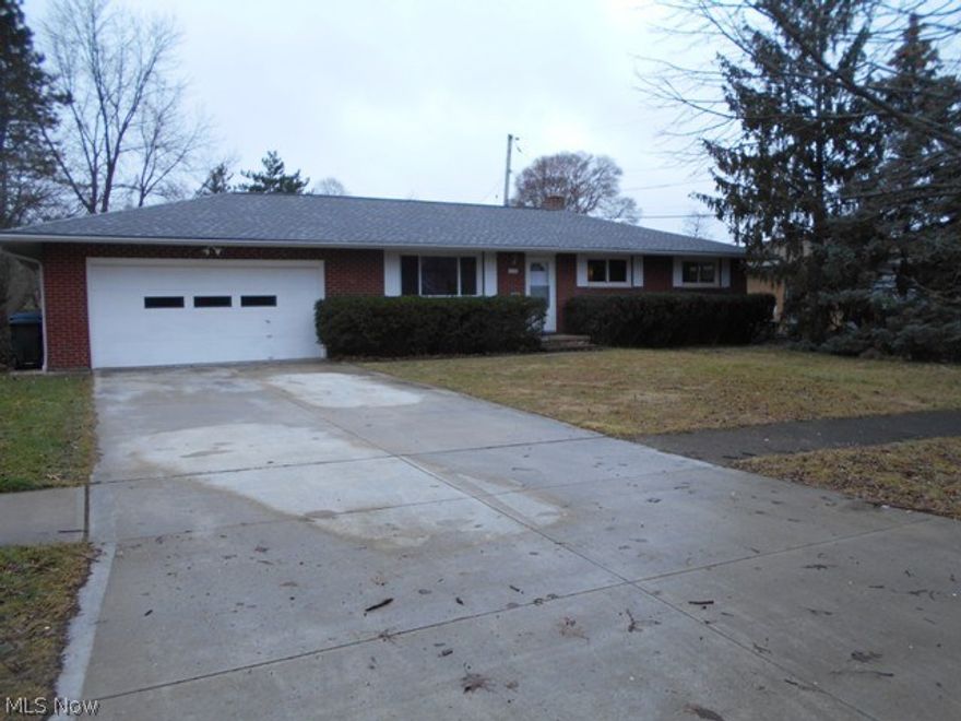 This classic brick ranch features a master bdrm that can accommodate a spacious bdrm set + 1/2bath and two other generous size bedrooms. Formal dining rm for hosting holiday gatherings, family meals/brunch, Kitchen with eating area. New carpeting/painting in 2018. Newer windows ,roof, driveway, side sidewalk + a hot water tank installed in 2017. Oversize recreation room for added living space, work shop and laundry area with shower /.commode, After you park the cars in this huge double attached garage there is plenty of rooms for tools, bikes and much more (work shop at the end of the garage. Fenced yard for tots and pets. GREAT LOCATION to shopping, places to eat and entertainment.
