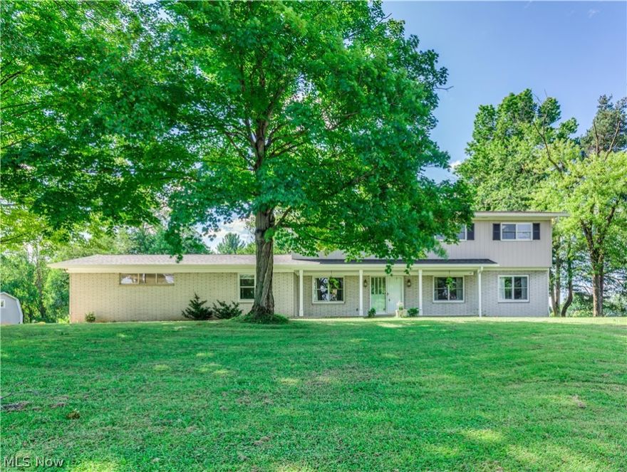 Don't miss this 5 BR 4.5 BA Bath home on 3.62 acres with a brand new kitchen, new septic, outbuilding & more! Slate tile foyer leads to large living room with hardwood floors & woodburning FP. Dining room w HW floors, new paint, built-in cabinet & leads to the office connected to back hallway half bath (could be 6th BR). Brand new wood cabinets, quartz c-tops, slate tile backsplash, pantry cabinet, black s/s appliances, recessed lighting & stylish vinyl flooring.  Family room off of kitchen features brand new carpet, wood burning FP w wood mantle & built-ins. Sunroom off of family rm will feature brand new Pella windows (to be installed in a few weeks), a wet bar & leads to enclosed 3 season rm on deck w brand new windows ('20, $16k investment), new patio door & deck flooring. Convenient laundry rm rounds out spacious 1st flr. Upstairs find 5 BRs & newer carpet. This home has 2 master suites. 1st master feat. 4 brand new Pella windows on the west side of the room & en suite full BA w n