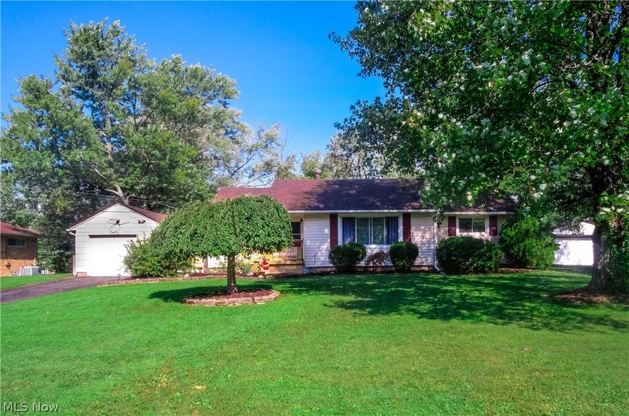 Yes, I am the most charming home on the street. I boast a younger Roof (on Storage Shed too), Vinyl Windows, H2O Tank, Electric Panel, Ceiling Fans Refrigerator, Kitchen Backsplash, Neutral Paint and softly glowing refinished Hardwood Floors. Make yourself at home in front of my wood burning stone fireplace with a convenient TV mount above. Host the Holidays in my Big 18X9 Dining Room! I feature 4 bedrooms, 2 Baths with the Basement Bath just remodeled. I offer "You Decide Space with my 2 cubbies. My Kitchen has been remodeled and all my Kitchen Appliances Stay. My Breezeway offers possibilities. Extra storage opportunities in my Partial Basement with a Crawl Space allowing for air to circulate.  Spacious Wood Deck off my back. I have public water and sewer on a Roomy .57 acres and my Driveway has a 2 Car Parking Pad for guests or turn around. Come see me and discover my flexible floor plan. Walk to shopping and dinning.