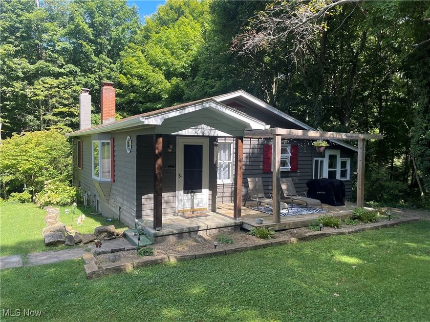 This charming home, nestled on a generous 1.51-acre lot in town features two bedrooms and one bathroom. A large bay window in the living area floods the space with natural light, creating a warm and inviting atmosphere. The three-season room provides additional space for relaxation or entertainment. The walkout basement adds significant value, boasting its own bathroom, a versatile storage room, a fireplace, and a work area for hobbies or projects. This property effortlessly blends functional living with serene outdoor space.