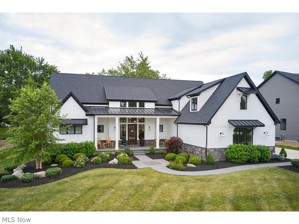 Experience the epitome of modern farmhouse elegance in coveted Highland Local Schools & Hinckley Township! Beyond its aesthetics, this home surpasses new construction expectations without the wait to build or post-construction costs. Situated on a cul-de-sac, this one owner home boasts over 4000 sq ft above grade, 5 bedrooms, 4.5 bathrooms, 3-car oversized garage & finished basement. Set against a backdrop of wooded views, relaxation awaits on the covered porches & built-in fire pit in the professionally landscaped, fenced yard. Bright foyer w custom wood front door, brick pillars, wood ceiling beams & amazing light fixtures creates the perfect entrance to this welcoming home. Great room seamlessly connects to the kitchen, dinette, covered porch & patio, creating a perfect venue for year-round entertaining. Brick accents elevate the Great room & eat-in kitchen, complementing custom designed cabinetry & high-end appliances in both the main kitchen & “messy kitchen.” Owner’s suite offers a serene retreat w luxurious ensuite featuring a tile shower, soaking tub linen closet & dream closet w island (swoon). Additional main floor highlights include office w built-in desks, laundry room w sink, mudroom & powder bath, all crafted with meticulous attention to detail. Upstairs you’ll find 3 bedrooms, 2 full bathrooms, large linen closet & second laundry room. Do not miss the bonus room w built-in benches & dormer windows for natural light. Finished lower level boasts tall ceilings, recreation room, fitness room w rubber flooring, bedroom, full bathroom, & sitting room. With its blend of sophistication & functionality, this Highland Schools residence promises a lifestyle of luxury & comfort. Being sold with a Whole House Generator, 7 televisions, Bose & Sonos Systems, Custom Window Treatments, Appliances, Washer/Dryer & Home Security System, this home is fully appointed & ready for the lucky new owner. Call for a private viewing & make this dream home yours today!