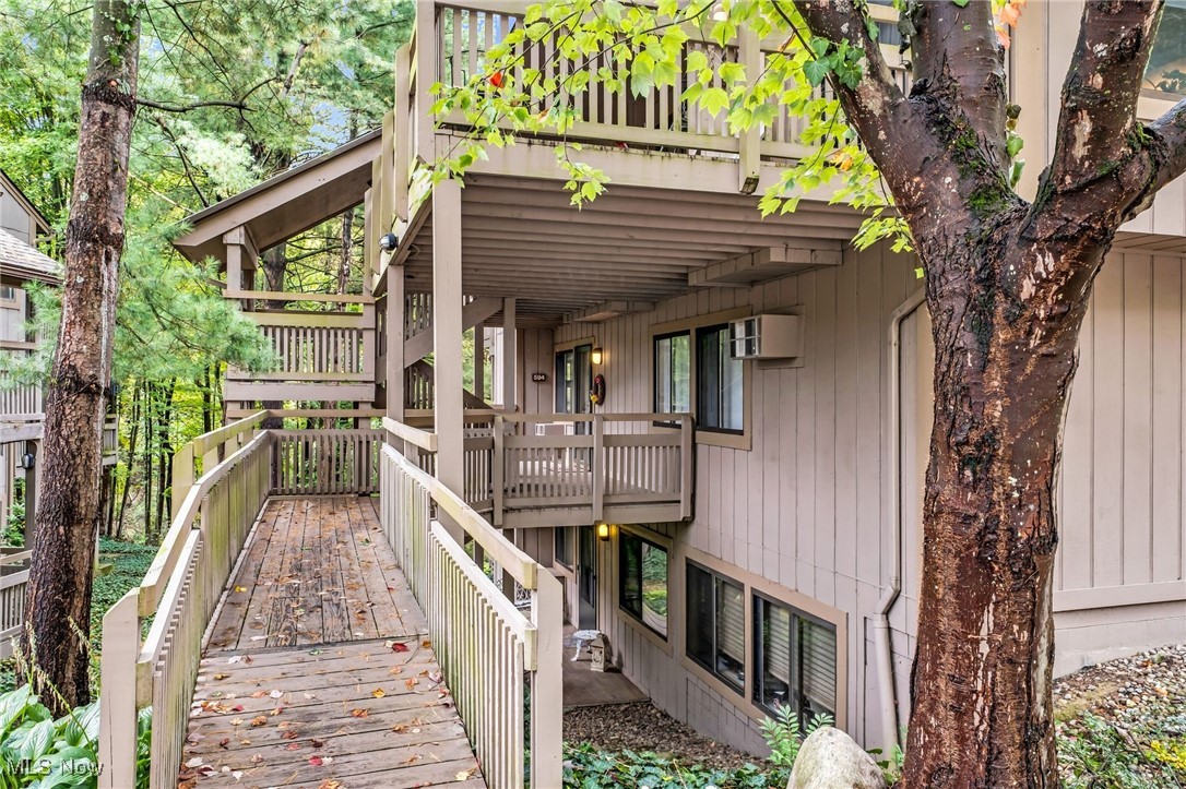 One floor living awaits at this updated two-bedroom, two full bath condominium in the Pine Mill Ridge subdivision. This home boasts a sizable and open ranch-style floor plan with over 1372 sq. ft. of living space! The expansive living area features a tiled entryway with large mudroom closet. Dining room with stone fireplace and wall of windows! Living room with gorgeous views and access to a huge covered deck! Kitchen boasts stainless appliances, pantry and breakfast bar! Upgraded luxury vinyl floors throughout the main living area! The owners suite is equipped with a private bath and two closets, one being a walk-in closet. A spacious second bedroom, laundry room with plenty of shelving and second full bathroom round out this incredible home! Experience the privacy and seclusion that this home offers while you enjoy the surrounding woodland view from the covered patio. Updates include luxury vinyl flooring, new ceiling fans, a/c wall units and fresh paint throughout the entire unit.