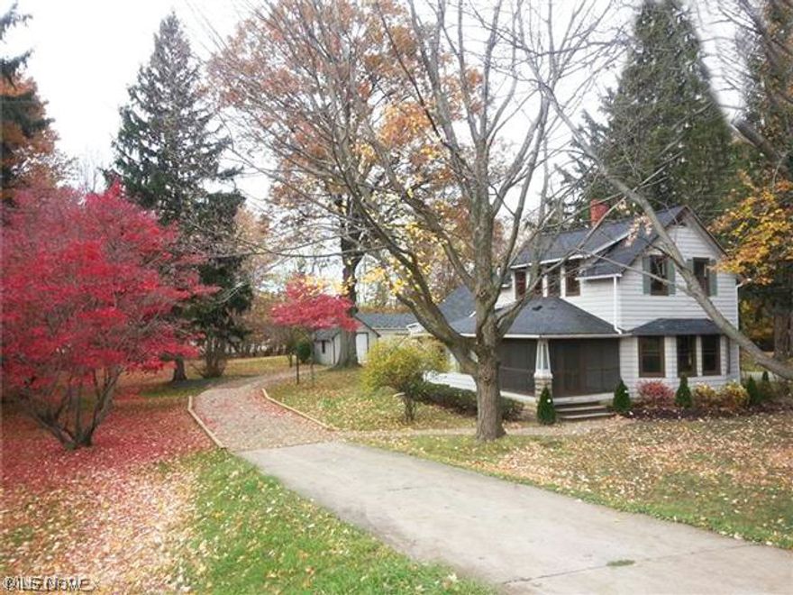 Over the hill and thru the woods!!  Absolutely lovely, right out of a Currier & Ives painting, this picturesque century home is situated on a nearly one-acre wooded lot, offering an amazing country oasis in Westlake, but just 2 minutes from Crocker Park and all conveniences!  This lovingly renovated 2-story home has just been remodeled to add modern function, yet restore its original charm!  Wonderful curb appeal and a great garage/barn 27 x 25 with loft is ideal for hobbyist or extra storage. Gleaming hardwood floors, gorgeous trim, beveled glass doors, cozy screened porch, lots of windows allowing natural light.  Inviting gathering room kitchen with handy center island is a great spot for culinary creativity and mealtime get-togethers, boasting built-in appliances, loads of solid cabinetry & counter space!  A fabulous breakfast bar w/ granite counter doubles as extra dining area and makes a great serving counter when entertaining, open to the impressive formal dining room, and the ad