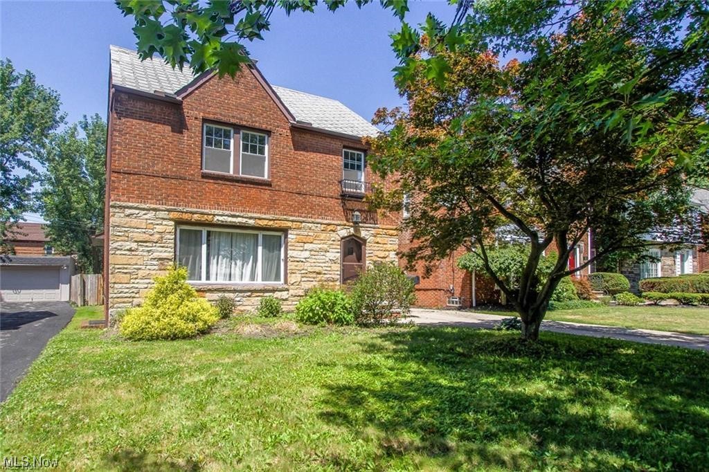 Wow! This Stunning Brick Colonial has so Much to Offer. 4 Bedrooms, 1.5 Baths. The 1st floor offers Large Living Room & Dining room with Beautiful Hardwood Floors. Family room W/ Built in bookshelf, Updated Kitchen and Half Bath. 3 Large Bedrooms and a Full Bath with Tub & a Separate Shower on the 2nd Floor. Additional 4th Bedroom on the 3rd floor. Rec Area in the Basement. Fenced in Back Yard! 2 Car Garage. New Central Air is being installed. Conveniently Located Next to Schools, Shopping and Parks and Easy Commute to Downtown Cleveland and Major Hospitals. Contact Us to Schedule a Showing Today!.