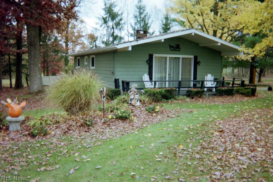 Great get a way place at beautiful Lake Buckhorn.  Two bedroom, 1 bath ranch home on four level lots.  Large deck wraps around the home.  Has a two car detached garage with cement drive and shop.  Includes a 24x40 pole building.  Peaceful and quiet.  Well maintianed and ready for you to enjoy.  Lake Buckhorn is a private lake community, south of Millersburg with a 1100 acre lake great for boating, skiing, fishing and swimming.  Common areas for lake acccess.