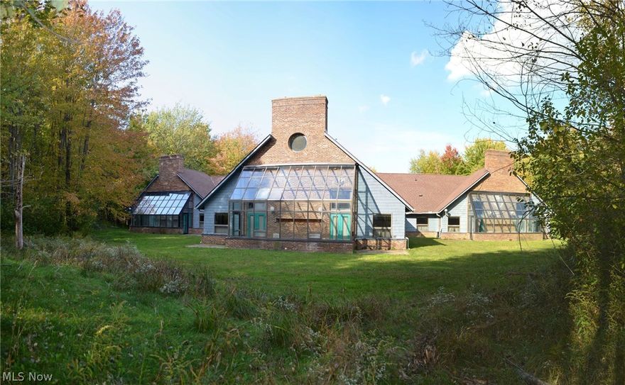 Own 135 acres of former Girl Scout "Camp Lejnar" adjoining Lake county Metroparks. Dramatic hilltop views of Paine Creek near Lake Metropark's Hell Hollow Park. Massive 6,752 two-story meeting hall, 2,703 sq ft Lake house/hall, 5 acre lake(~18' deep), 4 cabins with own bath and screen porch. platforms for tents,  62x32 barn with workshop and large split level caretaker's house, EPA approved sewage package plant.  Ravines, woods, trails, lake.