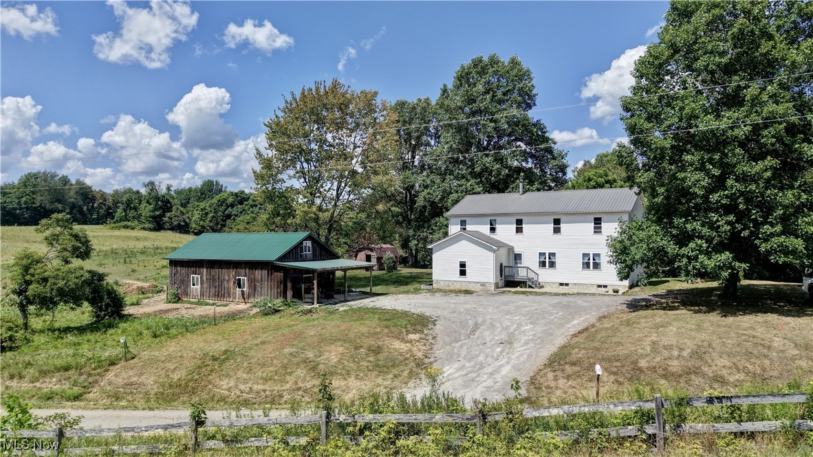 ONLINE ONLY AUCTION ENDING THURSDAY SEPTEMBER 11TH 6:00PM!!! Enjoy the peace and serenity of country living in this spacious and well-maintained home. Set on a 1.1 acre lot, shaded by mature trees this home offers the perfect blend of comfort, space and rural charm. Inside this Amish home you'll find a welcoming layout featuring a large kitchen and living room -ideal for gatherings and everyday living. With 1,700 square feet on the main floor and an additional 1,500 square feet upstairs, this home has 6 bedrooms and 2 bathrooms offering ample space for family or hosting guests. Step outside to large covered back porch, perfect for relaxing and enjoying the peaceful surroundings. A full basement with convenient exterior access. provides plenty of room for storage, hobbies or future expansion. The property also includes a newer-built barn and a storage shed, adding even more functionality and potential to this property. Since this is an Amish home there is no electricity. If your looking for quiet country living with room to grow this might be the perfect property to call home.
