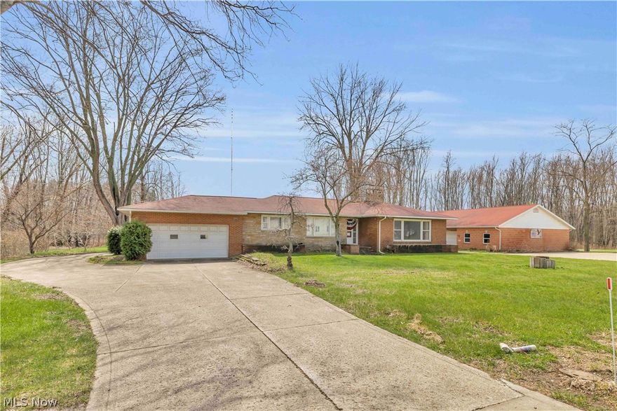 Prime 6.5+ Acre Live-Work Opportunity on High-Traffic US Route 20 in Madison,
OH
Rare opportunity to own a versatile property that perfectly blends comfortable one-floor
residential living with outstanding commercial potential.
This charming mid-century 3,500 sq. ft. brick ranch features 3 bedrooms, 2.5
bathrooms, a 2-car attached garage, semi-finished basement, and a peaceful 1/3-acre
stocked pond. Clean and well-maintained, it’s ready for your personal interior updates
and facelift.
Set in a high-visibility, high-traffic corridor on US Route 20, the property offers excellent
exposure and access for business. The separate 1,600 sq. ft. masonry building includes
gas heat, hot water, finished interior, half-bath, two offices, and ample storage—plus 4
parking bays and a 6-car concrete lot with prominent US 20 signage. Ideal for clients,
employees, or hobbies.
The 6.5+ acres consist of three parcels (two undeveloped totaling 5.15 acres), all zoned
commercial. Excellent flexibility for a gentleman’s farm, orchard, vineyard, or future
development and investment. Each parcel provides valuable US Route 20 frontage.
Utilities include electricity, natural gas, and city water. Confirm permitted uses with
Madison Township zoning officials.
Don’t miss this unique live-work-invest gem in a prime location. Schedule your private
showing today!