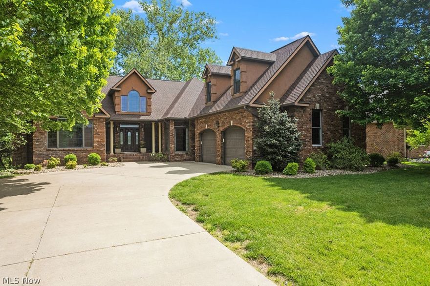 NEW ROOF. NEW FLOORING. NEW PRICE....Luxury living in a distinguished residential enclave awaits. Welcome to 9 Henderson Lane, a beautiful brick residence sited within one of the region’s most sought-after communities, renowned for its schools, proximity to leading hospitals, and the charm of nearby river towns. This home offers a rare opportunity for main-level living without sacrificing a luxury lifestyle. Inside, you are welcomed with soaring ceilings, architectural pillars, and refined finishes throughout. Offering 5 spacious bedrooms and 3.5 well-appointed baths, this home includes a private study, dedicated home gym, expansive family room, formal living and dining areas, and a chef’s kitchen with eat-in space. Above the oversized two-stall garage, you'll find a generous bonus studio, perfect for creative work, a guest suite, or additional living quarters. The walk-out lower level provides dedicated storage for lawn equipment, workshop space, and potential for even more finished square footage. Outside, a sprawling rear deck with wrought iron accents overlooks a partially fenced backyard with wooded views. Properties rarely come available here.  Priced at only $154 per sqft, don't miss out.