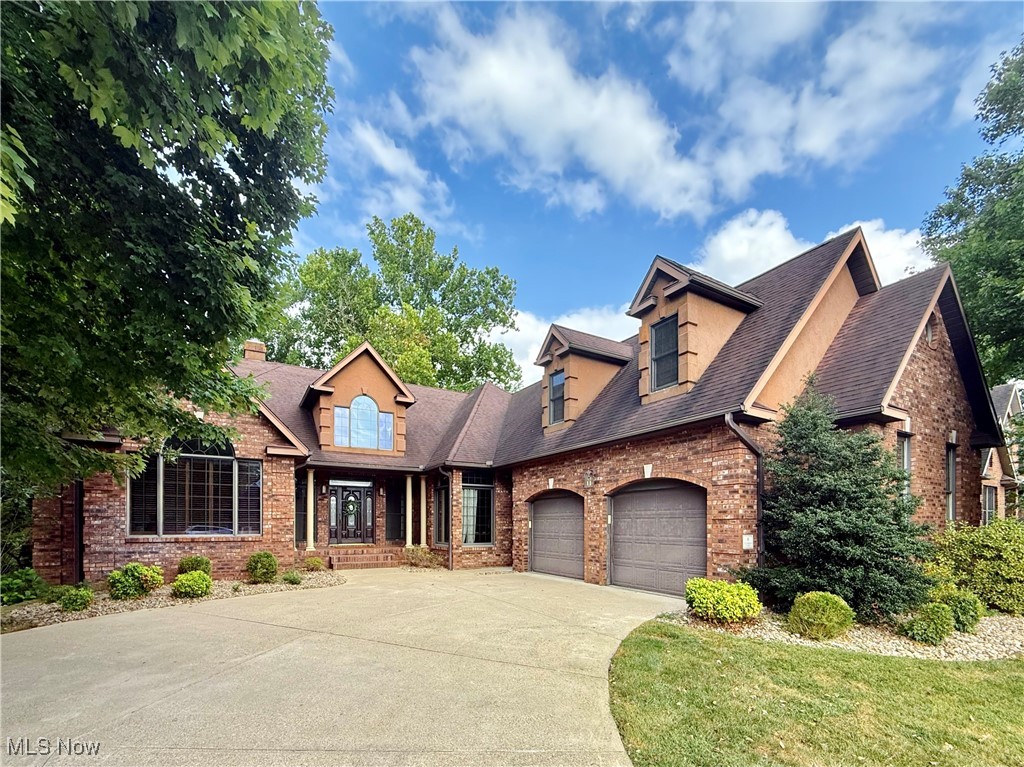 Luxury living in a distinguished residential enclave awaits. Welcome to 9 Henderson Lane, a beautiful brick residence sited within one of the region’s most sought-after communities—renowned for its schools, proximity to leading hospitals, and the charm of nearby river towns. This home offers a rare opportunity for main-level living without sacrificing the luxury lifestyle you deserve. Inside, you are welcomed with soaring ceilings, architectural pillars, and refined finishes throughout. Offering 5 spacious bedrooms and 3.5 well-appointed baths, this home includes a private study, dedicated home gym, expansive family room, formal living and dining areas, and a chef’s kitchen with eat-in space. Above the oversized two-stall garage, you'll find a generous bonus studio—perfect for creative work, a guest suite, or additional living quarters. The walk-out lower level provides dedicated storage for lawn equipment, workshop space, and potential for even more finished square footage. Outside, a sprawling rear deck with wrought iron accents overlooks a partially fenced backyard with wooded views. Properties rarely come available here—schedule your private tour.