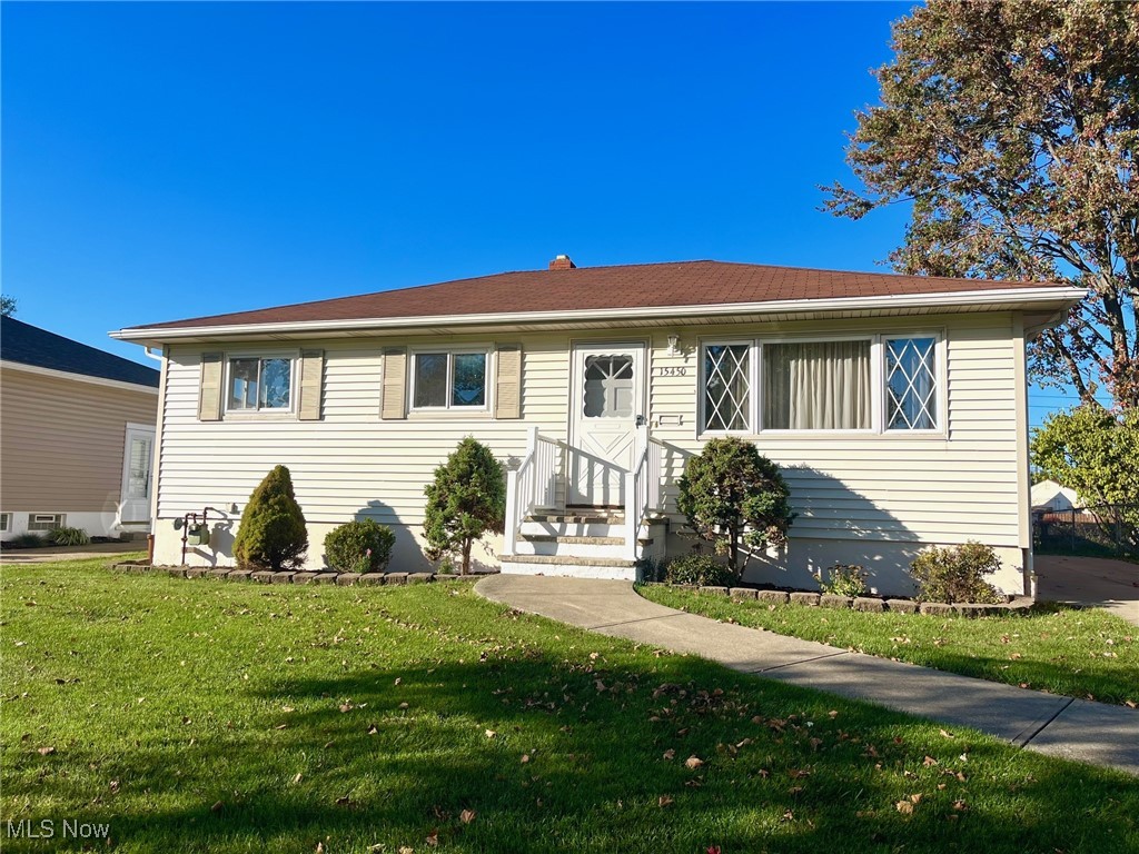 Meticulously maintained and filled with care, this ranch-style home radiates comfort from the moment you step inside. Freshly painted walls and gleaming hardwood floors invite you to explore a thoughtfully designed layout offering three distinct living spaces—a light-filled living room, a functional family room with access to the yard, and a finished recreation room in the basement. At the heart of the home, the spacious eat-in kitchen (updated in 2003) features ceramic tile flooring and all appliances included. Four comfortable bedrooms, each with hardwood flooring, provide flexibility for family, guests, or a home office. A full bath on the main level offers everyday convenience, and the addition of the fourth bedroom and family room expands both space and versatility. Downstairs, the large finished recreation room is ideal for a home theater, gym, or playroom. The lower level also includes a laundry area (washer and dryer included) with utility sink and water closet for added practicality. The detached two-car garage (built in 2006) complements the well-kept property, complete with a concrete driveway and garage floor (2005) and a nicely manicured yard ready for outdoor enjoyment. Major improvements include: furnace (2005), carpeting (2009), hot water tank (2010), roof, glass block windows, and refrigerator (2011), and dishwasher (2016). Lovingly maintained for decades, this home is a reflection of care and attention—ready for its next chapter. It’s a place where comfort, pride, and possibility come together.