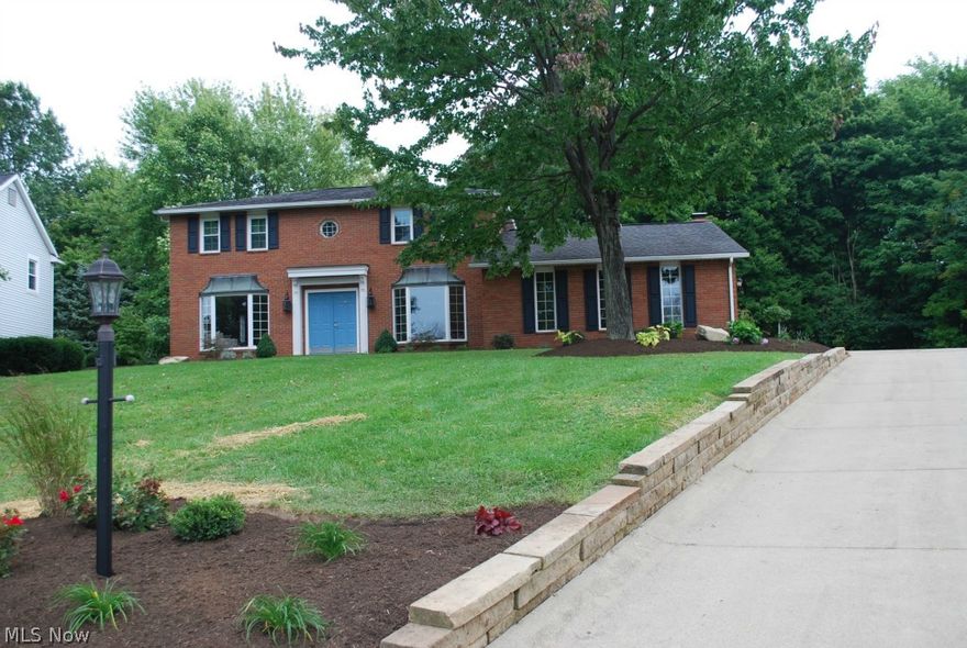 Welcome Home to this Stately all Brick Colonial Home!  This home has been totally renovated in every room.  There is crown molding throughout and hand scrapped hardwood floors.  Brand new Whirlpool Stainless Steel Appliances with Corian countertops with an under mount stainless steel sink.  Beautiful Bay Windows in the front along with all brand new Anderson Casement Windows throughout the whole home.  Along with the windows there are all new doors with French Doors leading to an all brick patio to enjoy entertaining your guests.  Enjoy the all season sun room year round.  The master suite is a retreat with the huge walk in closet and custom shower.  Just new in 2013 is the high efficiency Carrier heater and Air Conditioner with an upgraded media air cleaner.  The basement is a great play room for the kids or adults with a full bath.  This home is practically brand new and a must see!!