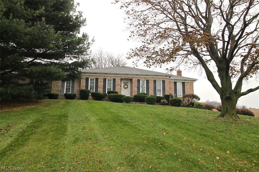 If you are looking for that perfect home on a nice plot of land with mature trees to make all your own, look no further. Take a look at this beautiful three bedroom, two full bath brick ranch home on 1.34 acre of land with picturesque landscape sitting atop the hill. Somewhat of an open concept already, the generous sized living room is open to the dining room which flows nicely through to the spacious kitchen and around the the family room. Easy access from the family room offering built in storage to the nice sized deck overlooking gorgeous farmland. Once you come in from the cold outdoors you can cozy up by the woodburning fireplace for those cold winter nights.  Let's talk about the generous sized kitchen with plenty of counter space as well as storage, there is also room for your table and chairs for an eat in kitchen with lots of natural light coming thru. Down the hallway, you will find the master suite as well as two other spacious bedrooms with a full guest bath. As you head d