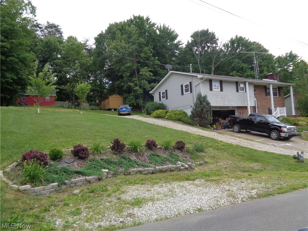 UPDATES Galore!!! Move in Ready.... Lubeck Location... This 3-Bedroom Features... 2-1/2 Bathroom...a large kitchen with an 8' Island...oversized Family Room with a wood Burning fireplace...2- rear decks to enjoy down time, a 20x14 Amish made storage shed with a loft..currently used as a wood shop..
.2 lots in a quiet neighborhood... Brand new carpet ..freshly painted..raised garden for your flowers, vegetables or herbs.. New Dimensional Roof with
transferable warranty. New Concrete Driveway being poured in the next few days..