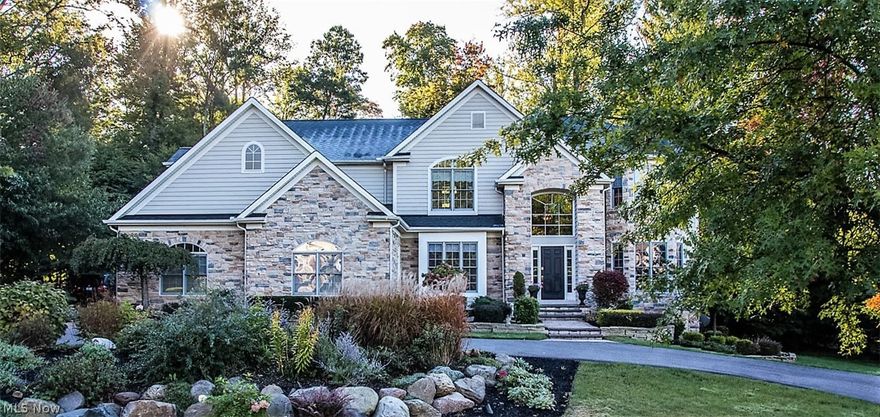 Spectacular and sophsiticated with style and elegance! Custom built well maintained one owner home. House beautiful front and backyard professionally landscaped property right from the moment you walk up the newly paved entry into the open and inviting floor plan.  Hardwood floors and newer lighting throughout. 2016 updated gourmet kitchen with high end stainless appliances, granite counters, oversized island and spacious eating area. 2 story family room highlighted by the wall of floor to ceiling palladium windows and stone fireplace.  1st floor private office w cherry stained woodwork and wood beams. Open living and dining rooms perfect for entertaining! Master bedroom w glamour master bath including frameless glass door large walk-in shower.  3 additional spacious bedrooms with large closets and 2 additional baths all w granite counters. Special features of this home include the spacious back hallway mudroom area with storage closets and built in desk workspace; front and back stair