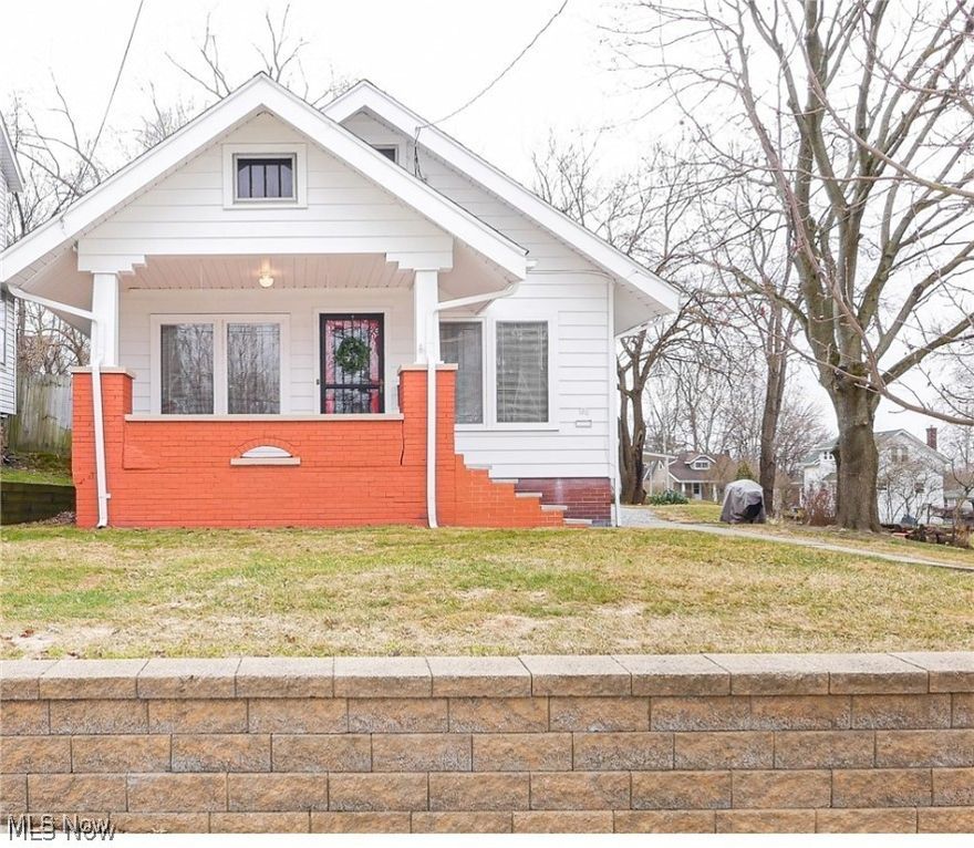 Move in ready, remodeled kitchen -- frig, stove microwave and washer & dryer stay. Leaded glass windows, all wood doors throughout, ceiling fans throughout, high ceilings. Linen cabinet in hall for extra storage. Finished attic with original antique windows and new carpet. Secret closet access for both bedrooms. Large dry basement with high ceilings, shower in basement, updated electrical box, lots of newer plumbing. Old coal room in basement could be redefined as a contemporary wine room. House sits on 2 city lots.