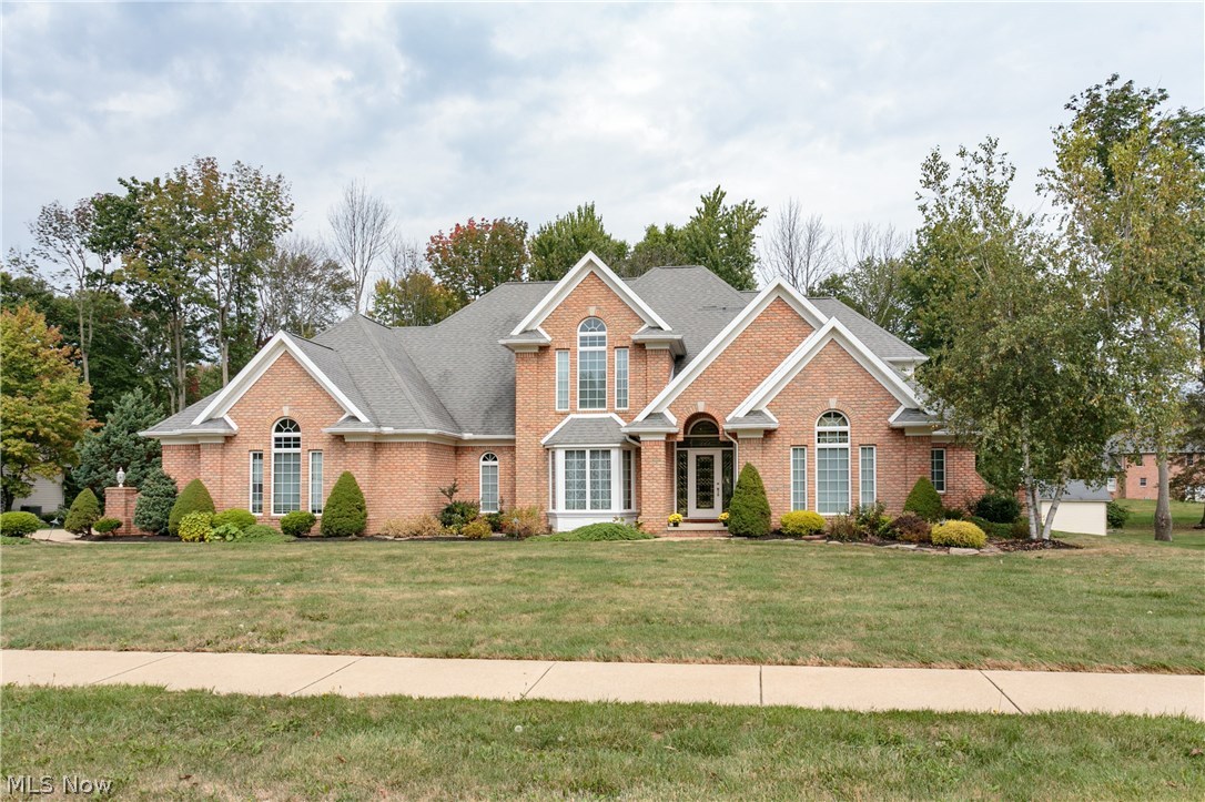 Beautiful brick contemporary home includes main floor master bedroom and bathroom with his and her vanity sinks and walk in closet. An entertainers dream of an open kitchen with beveled granite countertops , ample kitchen cabinetry and eat-in kitchen. Home also includes a spacious family room with soaring vaulted ceilings, built-in shelving where you can also cozy up in front of the beautiful fireplace during the upcoming winter season. This property also features a private study, dining room and three bedrooms located on the second level. The roughed in basement has loads of potential with its already fully finished bathroom and shower. The wooded backyard allows for plenty of privacy and is a gardeners dream with its plentiful pear trees ready for fall harvest. This property has it all. Call and schedule your showing today.