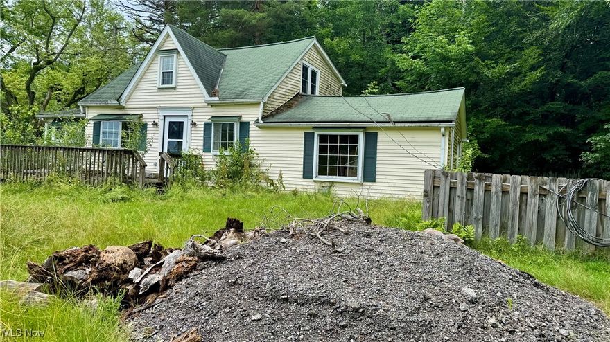 The house is a teardown. 2-car garage with electric and concrete in good condition. It is currently being used for storage.   Septic is in place and well. 
  It's a lake community in the Kenston School District. Walk to Bear Town Park. Buyer and buyer's agent to do their due diligence.