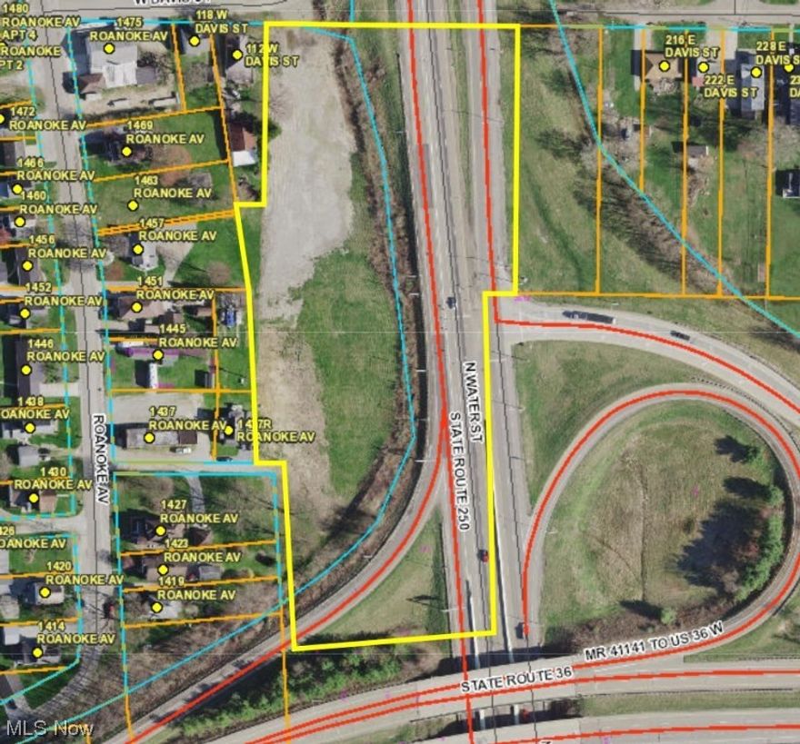 Over 6 acre level lot with frontage on Davis Street and high visibility from State Route 250/North Water Street.  Zoned business/light industrial.  City water and sewer are available to the property.  Usable acreage is subject to State of Ohio right of way for highway usage.