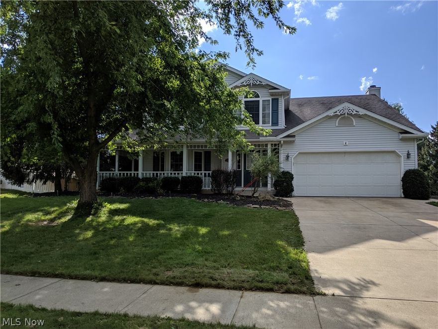 Walk into your custom  home in a desirable neighborhood in Historic Medina!  Located on a cul-de-sac and close to schools, parks, highways, and shopping!  Enter from the wrap around front porch into an updated colonial with bay windows in the  living room and large master suite on the second floor.  A kitchen upgraded with granite counters, hard wood floors, and a sliding door to walk out and enjoy your multi level deck with a retractable awning,  and a custom built gazebo.  The kitchen is open to the bright family room with a ceramic surround fireplace.  Upstairs is your master suite with private bath, three bedrooms, one with a soaking tub and bath, a bonus room, and another two full baths.  The basement is partially finished with Owens Corning finishes.  Don't miss this one!